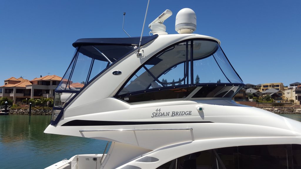 Searay Sedan Bridge full clear enclosure using Strataglass Prestige Marine Trimmers, Boat
