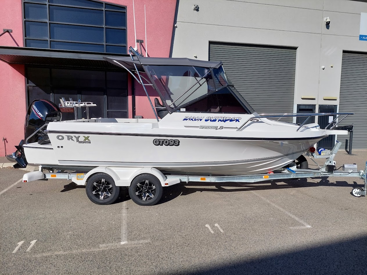 Bimini with front and side clears and a rear shade extension fitted to a trailer boat