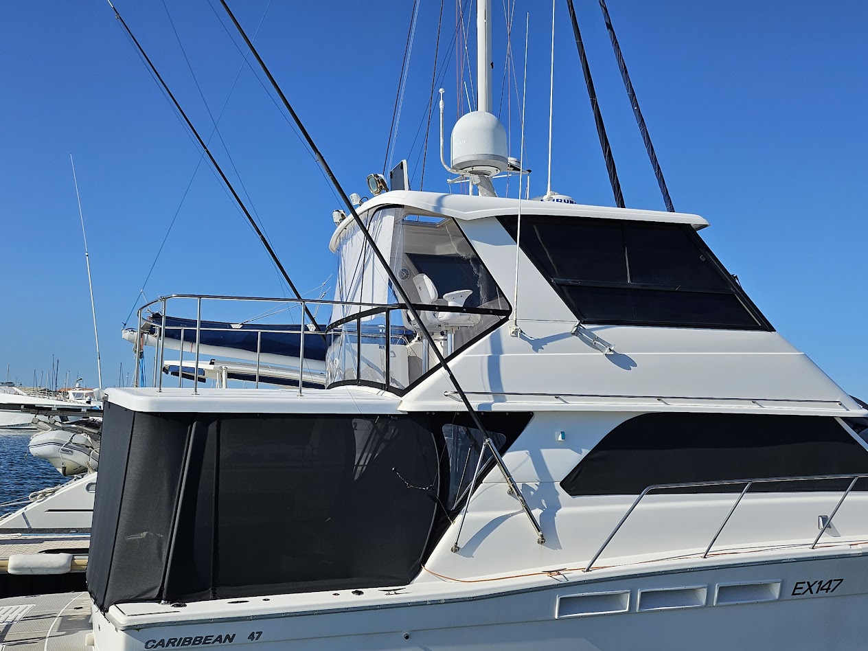 Caribbean 47 with rear flybridge clears and a full cockpit enclosure built to defence-grade standards